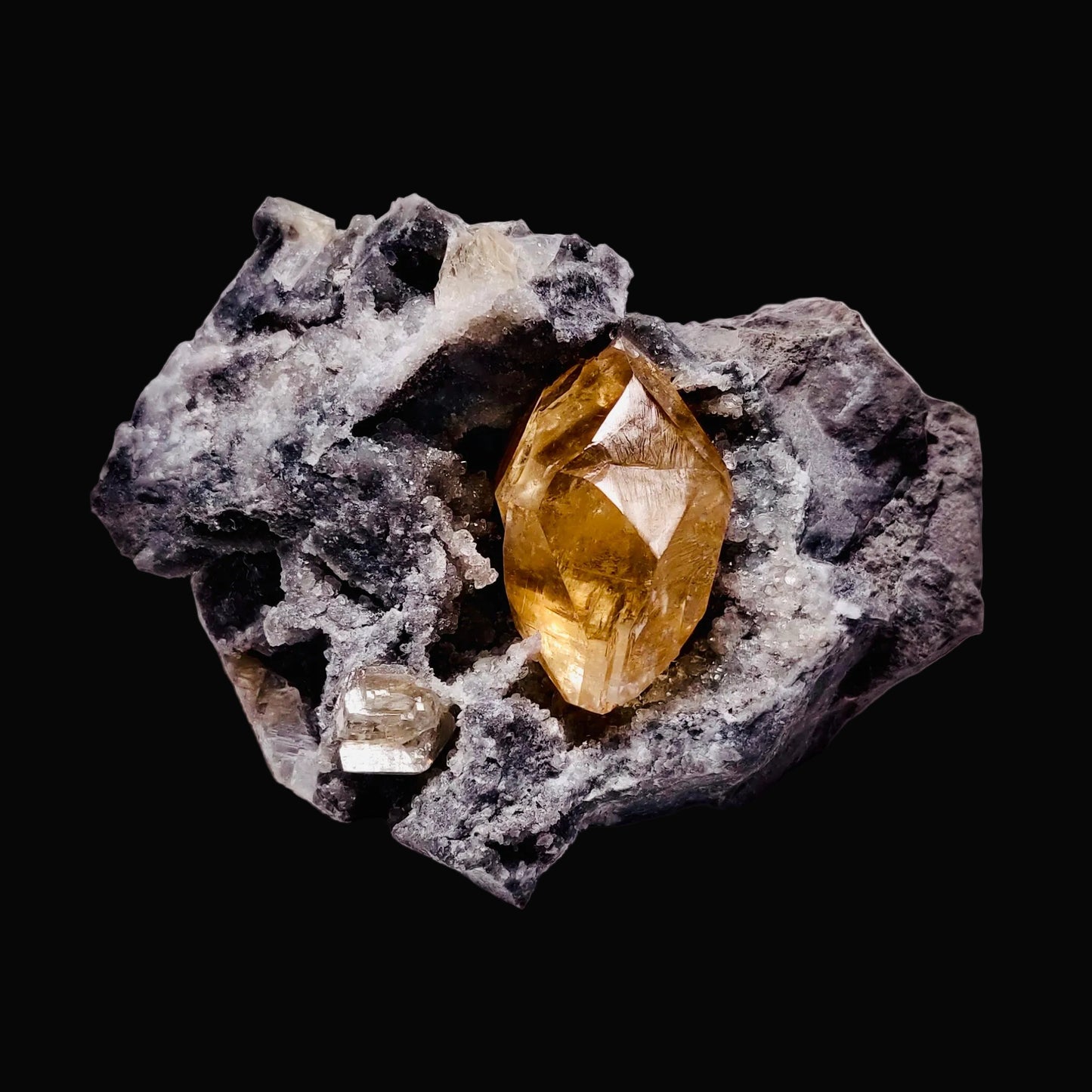 A double-terminated calcite crystal with strontianite, Valley Quarry, Shippensburg, PA.