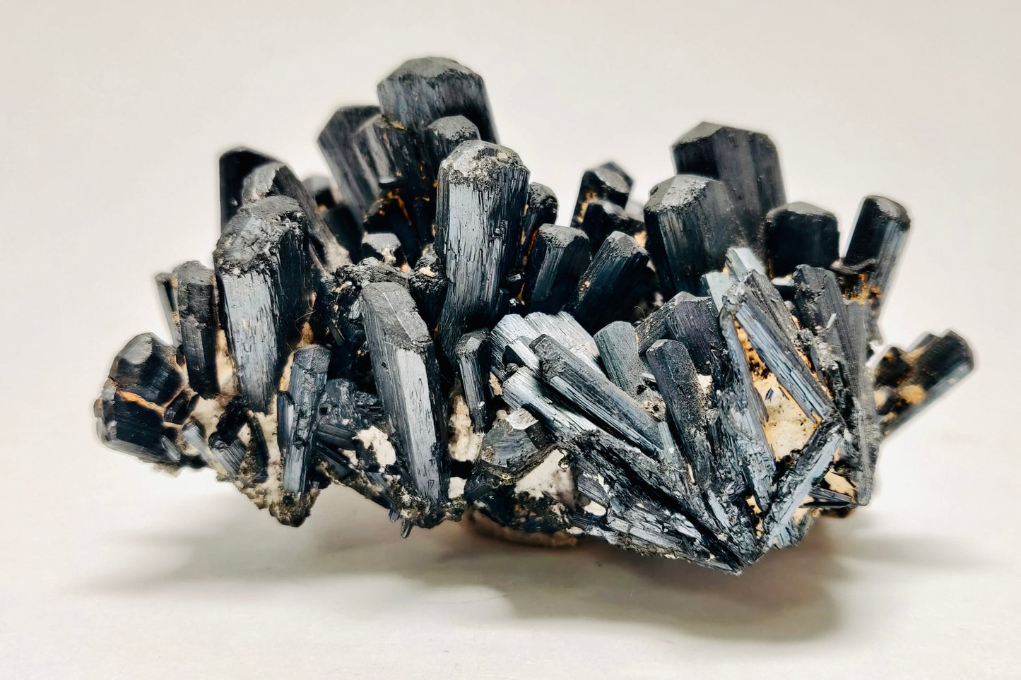A polished Stibnite crystal specimen with a metallic luster, needle-like formations, from the Herja Mine, Romania.