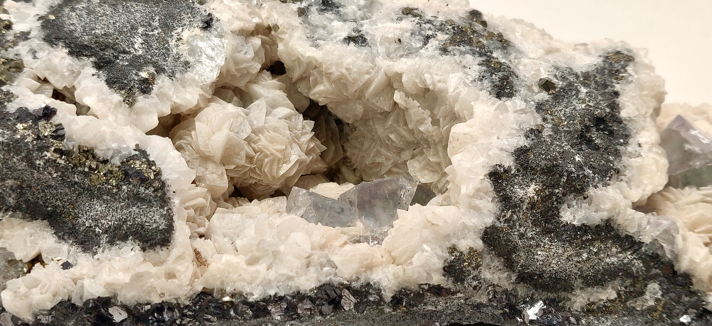 Close-up of a mineral sample with crystals and rock