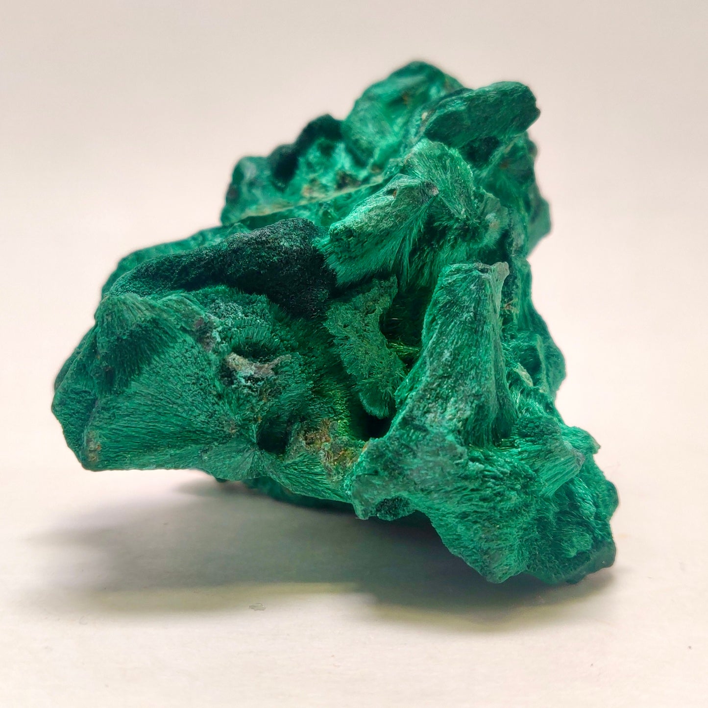 Green mineral rock on a white background