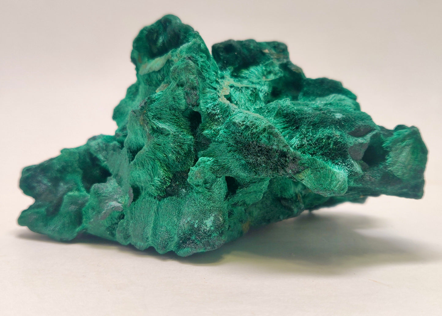 Green mineral rock on a white background
