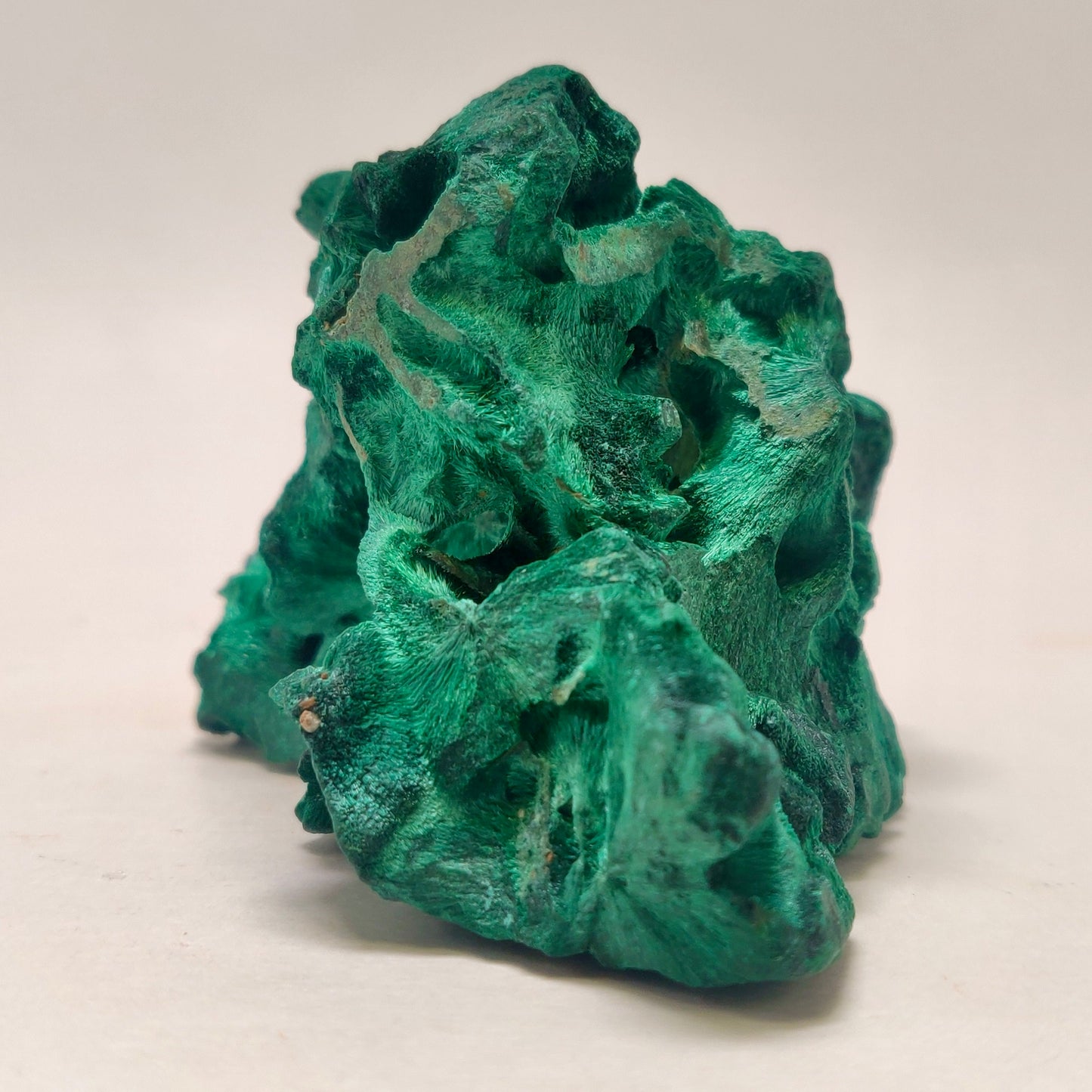 Green mineral rock on a white background