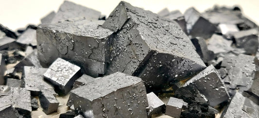 Close-up of metallic silver cubic crystals with textured surfaces at Gatsby Gems LLC