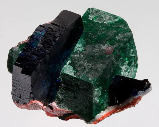 Azurite and green crystal mineral specimen with well-defined edges on white background