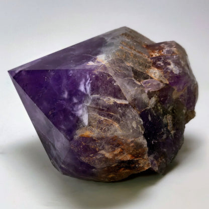 Amethyst crystal on a white background