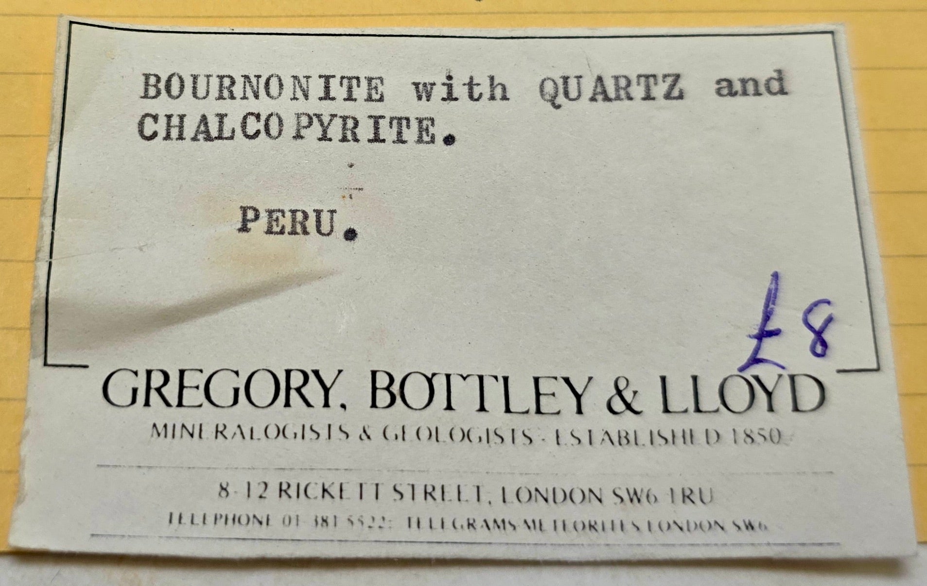Vintage label for Bournonite with Quartz and Chalcopyrite from Peru, featuring Gregory, Bottley & Lloyd.