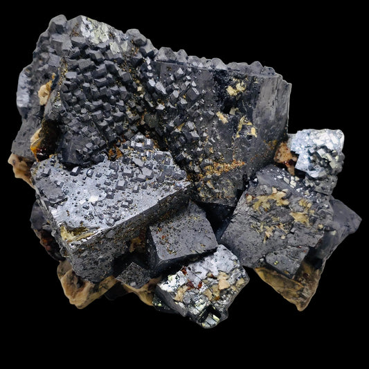 Mineral sample with metallic luster on a light background