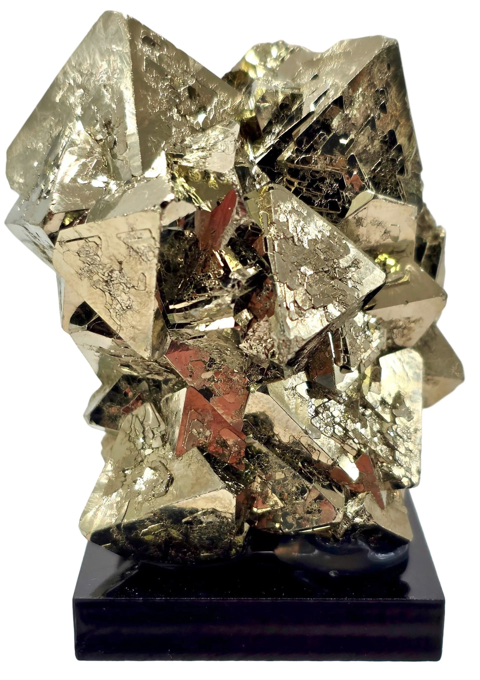 Pyrite crystal on a black stand against a white background