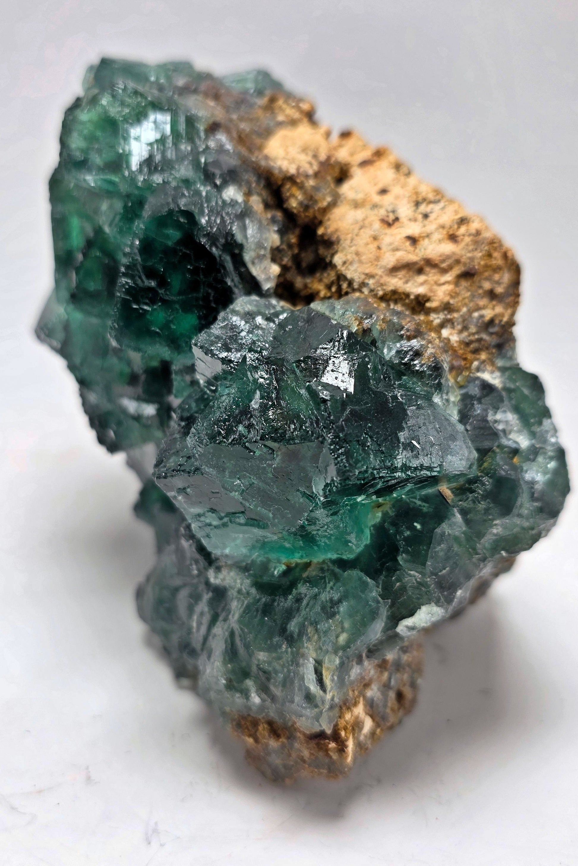 Green crystal rock on a white background