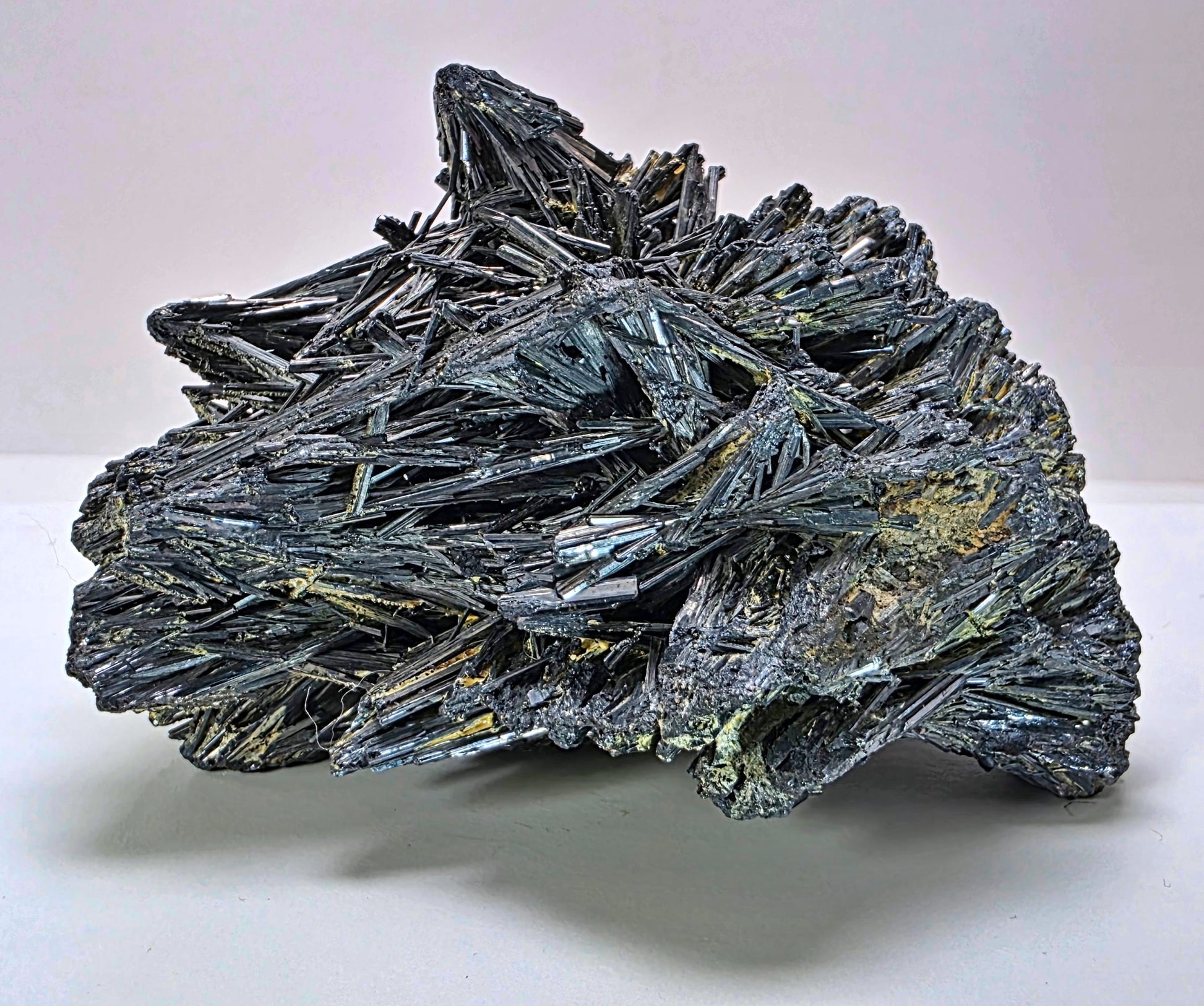 Mineral specimen with crystal formations on a white background