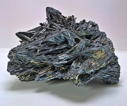 Mineral specimen with crystal formations on a white background