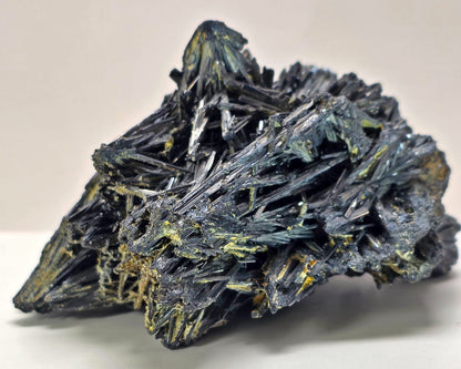 Mineral specimen with crystal formations on a white background
