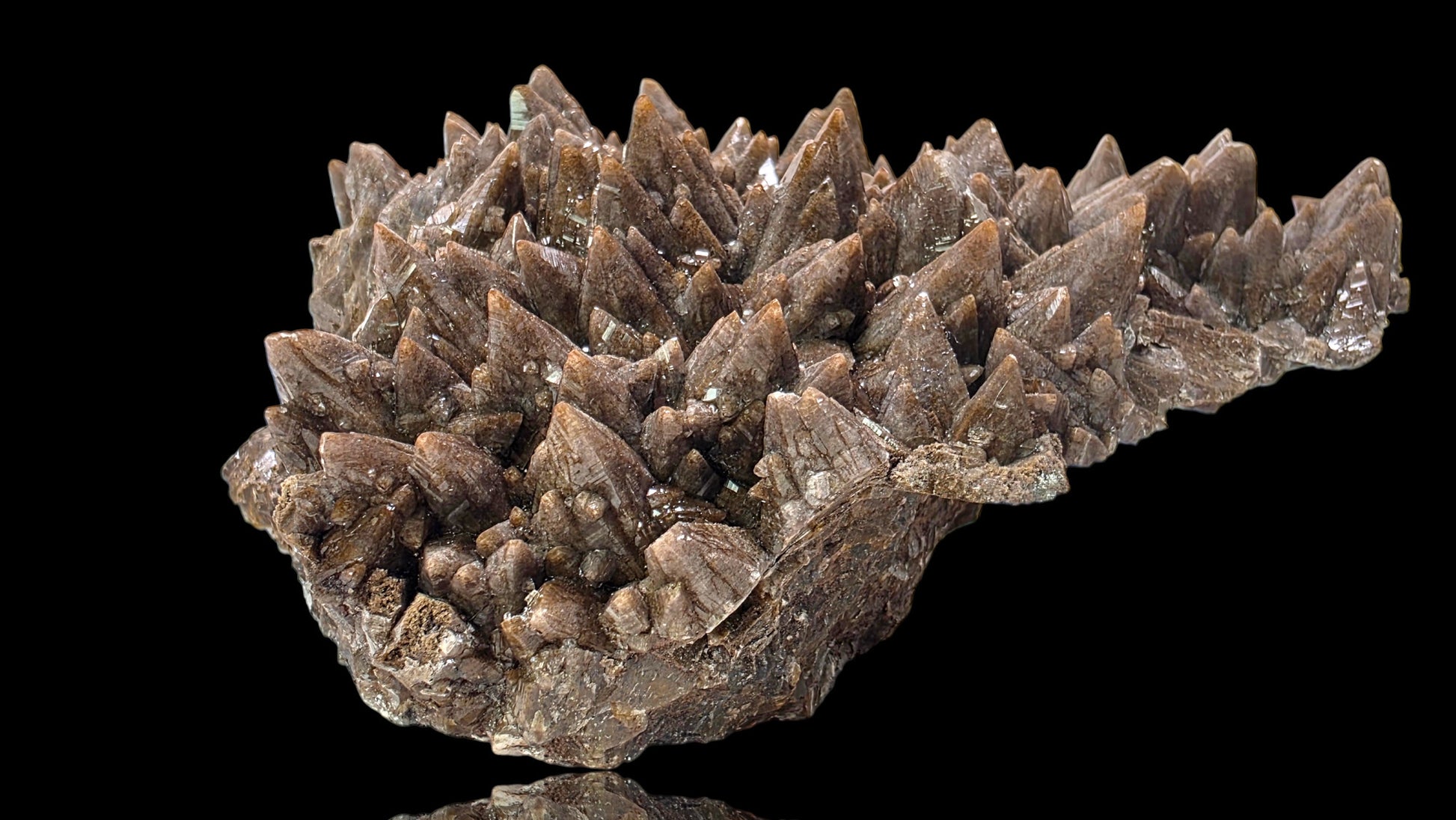 Mineral specimen with crystal formations on a black background