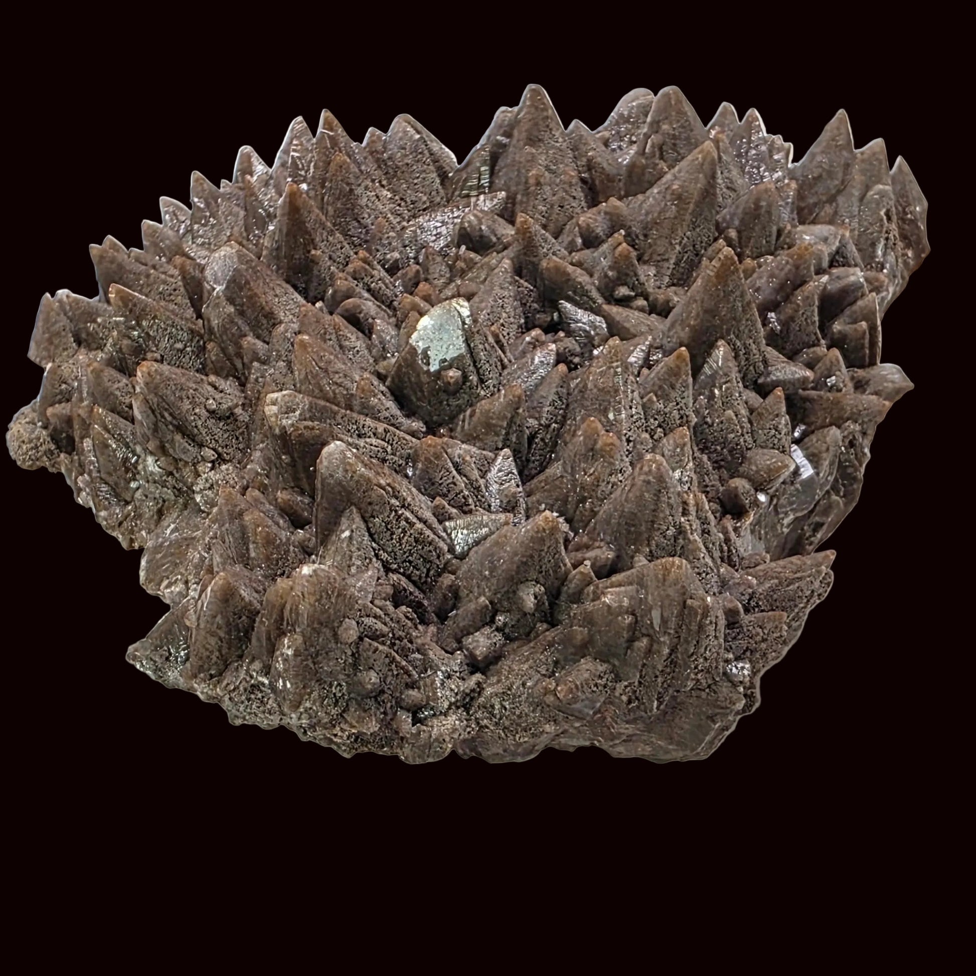 Mineral specimen with spiky crystal structure on a black background