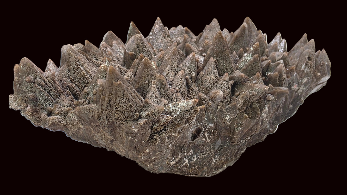 Decorative stone bowl with spiky texture on a white background