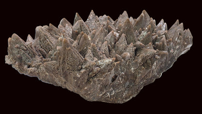 Decorative stone bowl with spiky texture on a white background
