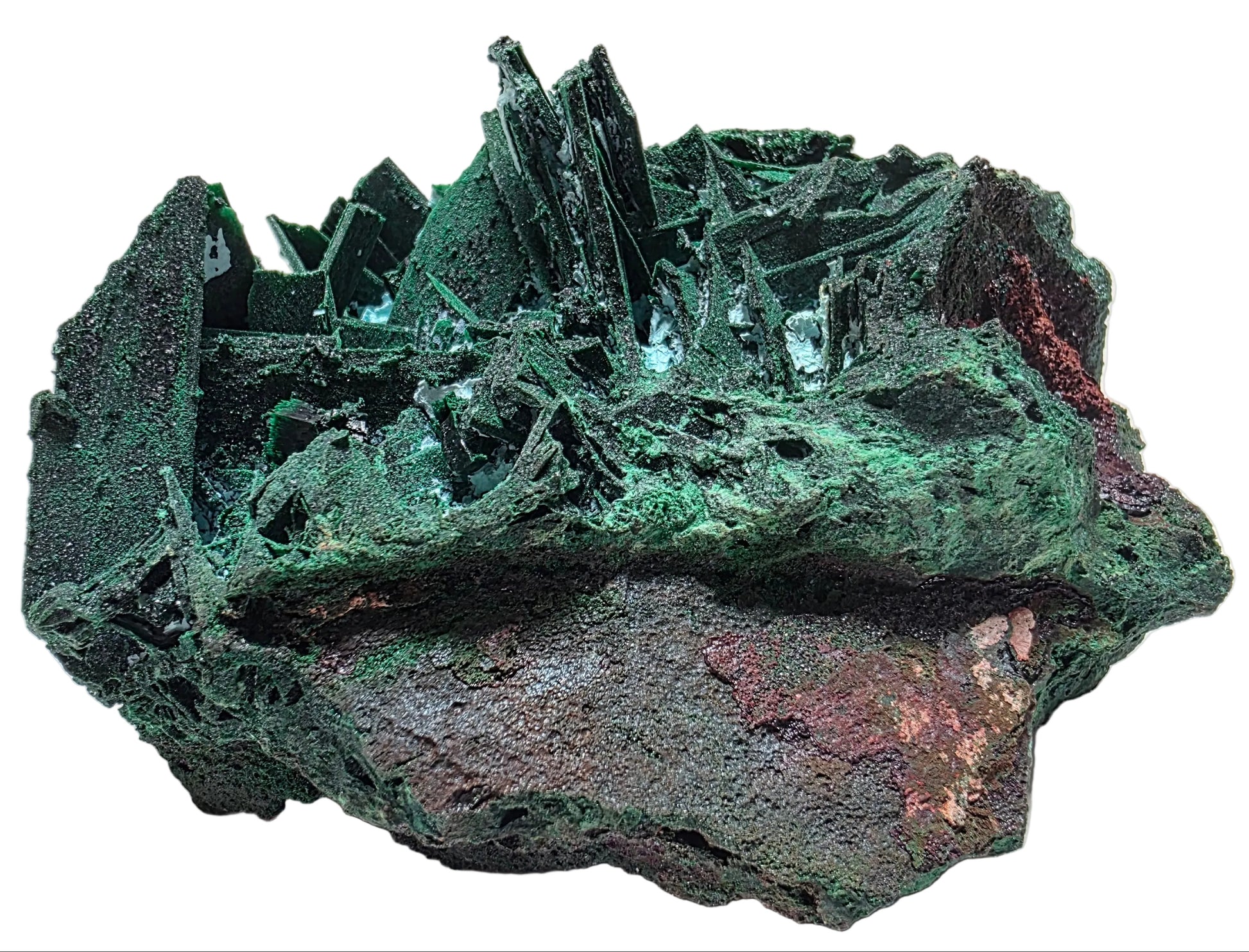 A natural green malachite crystal cluster specimen with a rough, textured matrix, photographed on a plain light background.