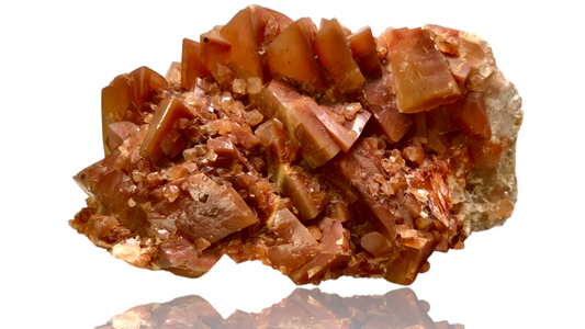 Mineral sample with a brownish-red color on a white background