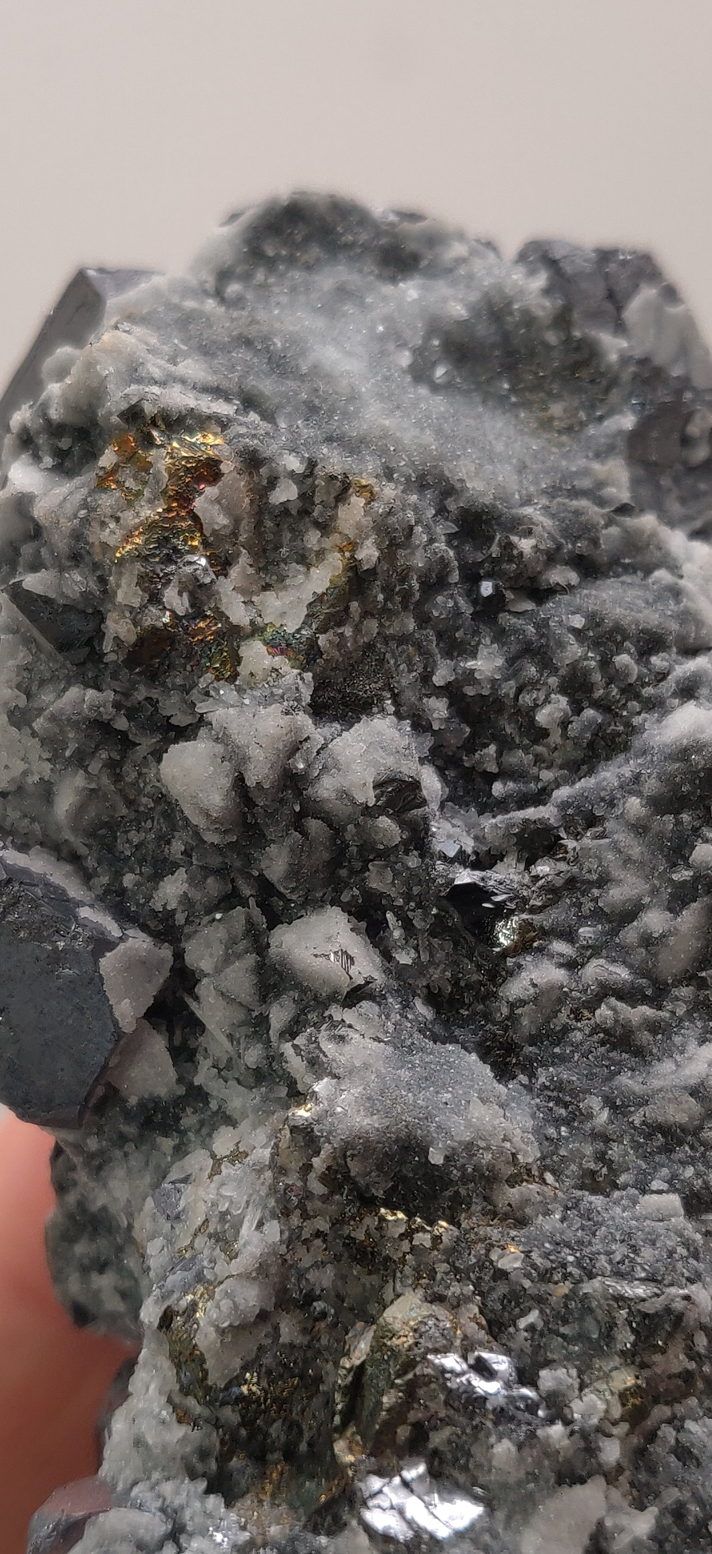 Close-up of metallic Galena crystal cluster with jet-black octahedral Sphalerite and golden Chalcopyrite from the Madan Ore Field, Bulgaria.
