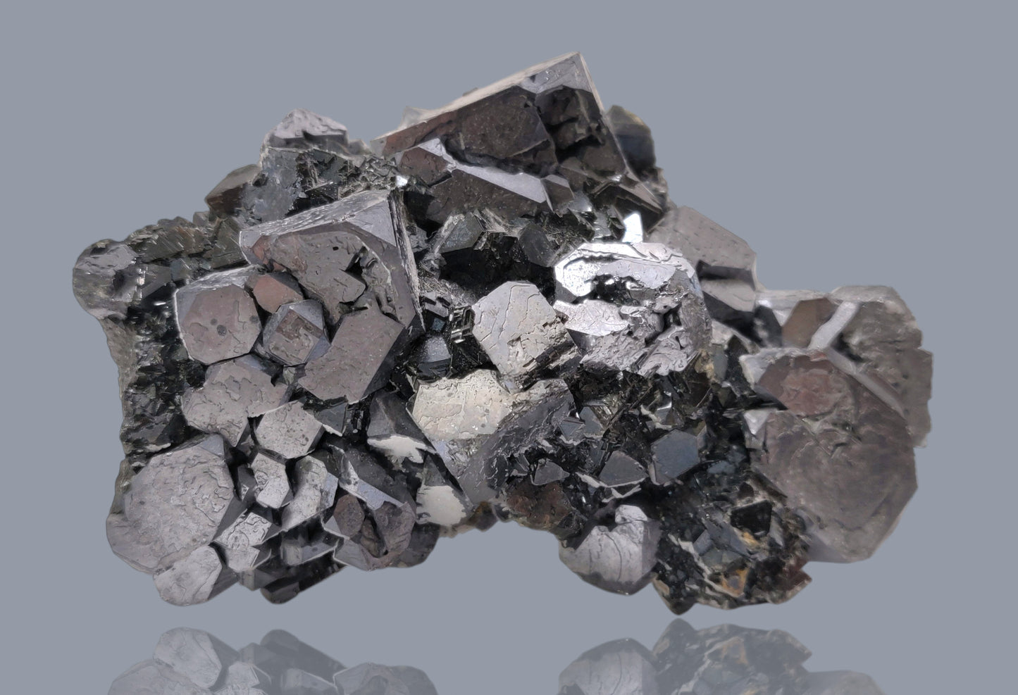Close-up of metallic Galena crystal cluster with jet-black octahedral Sphalerite and golden Chalcopyrite from the Madan Ore Field, Bulgaria.