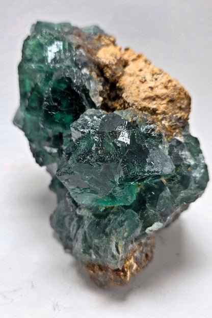 Green crystal rock on a white background