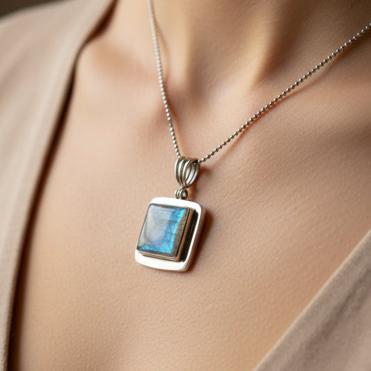 Necklace with a blue pendant worn by a person