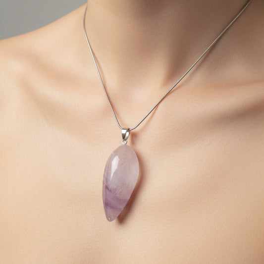 Necklace with a pink pendant on a mannequin