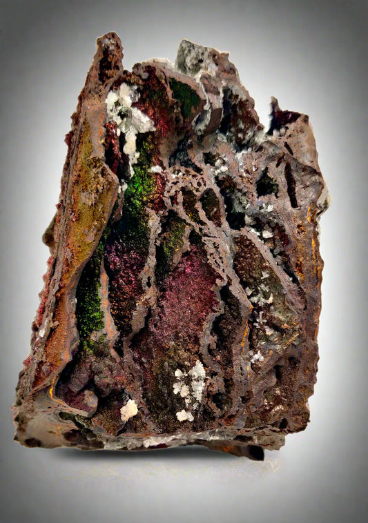 Mineral sample with intricate textures and colors on a white background
