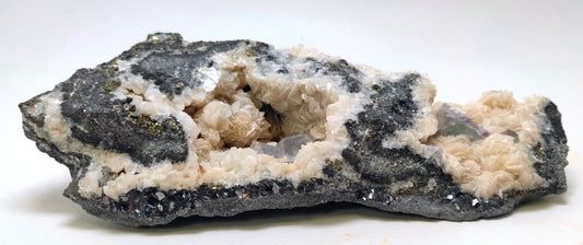 Mineral sample with black and white colors on a white background