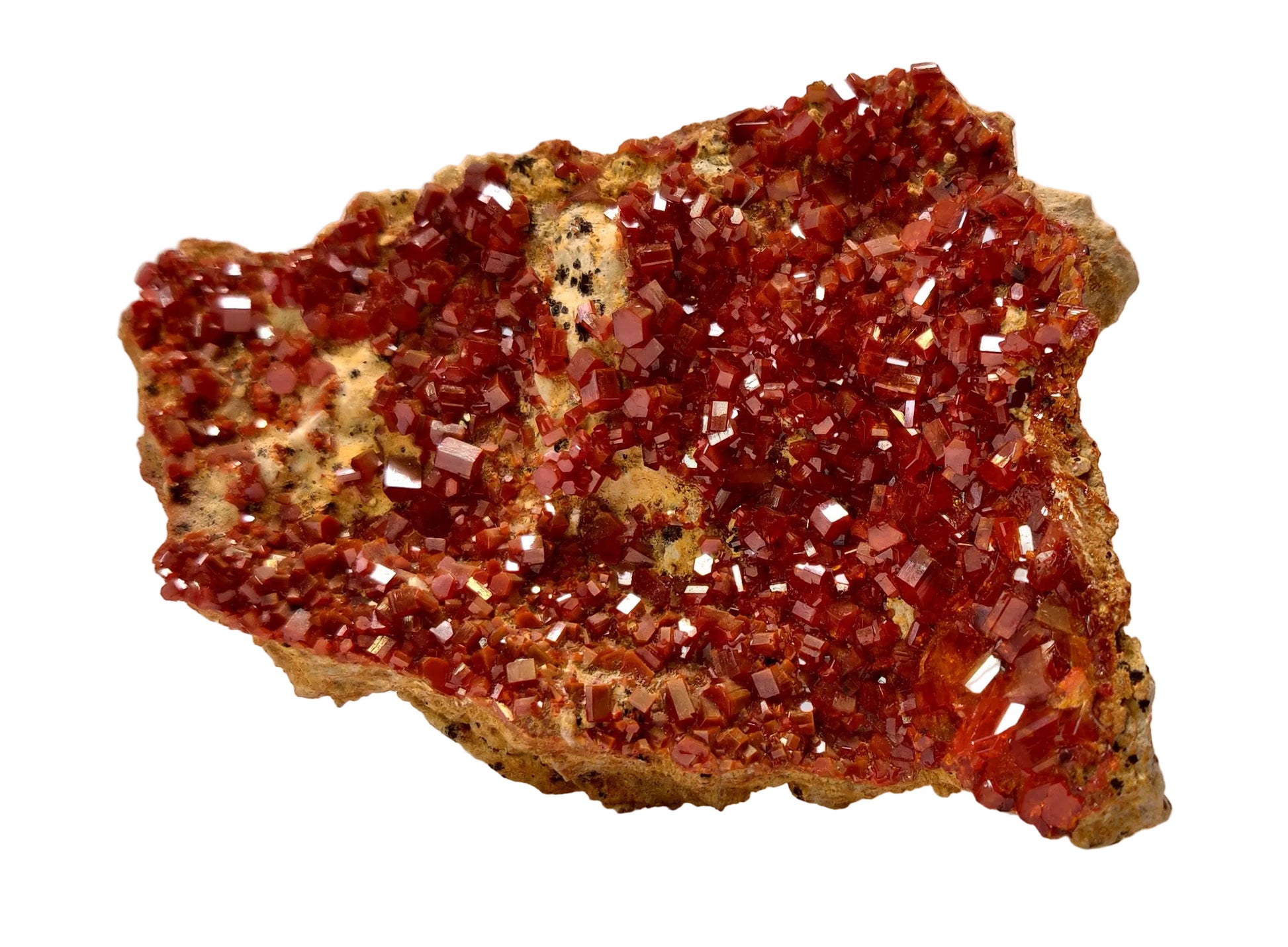 Red crystal mineral on a beige background