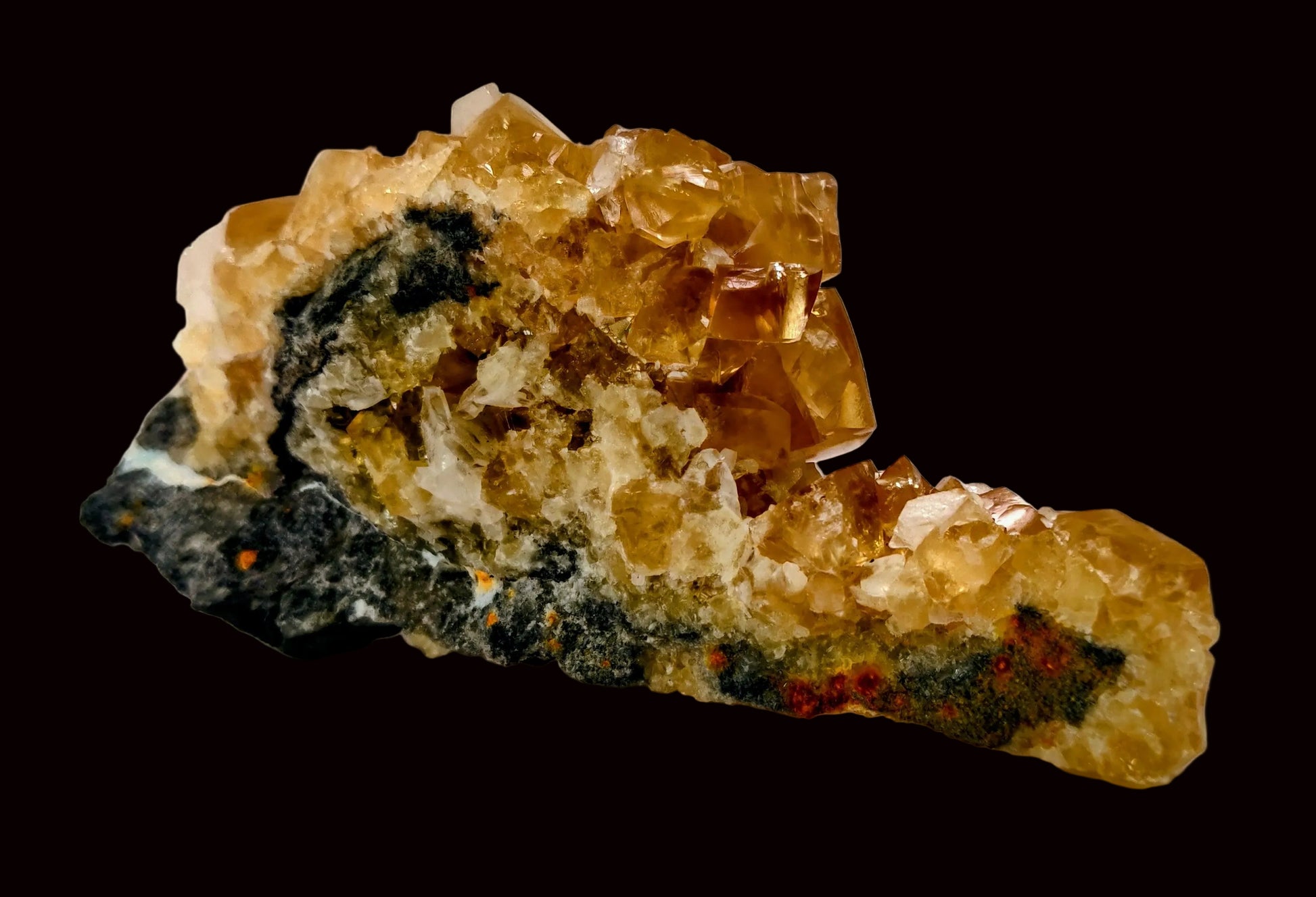 Mineral sample with yellow and black crystals on a white background
