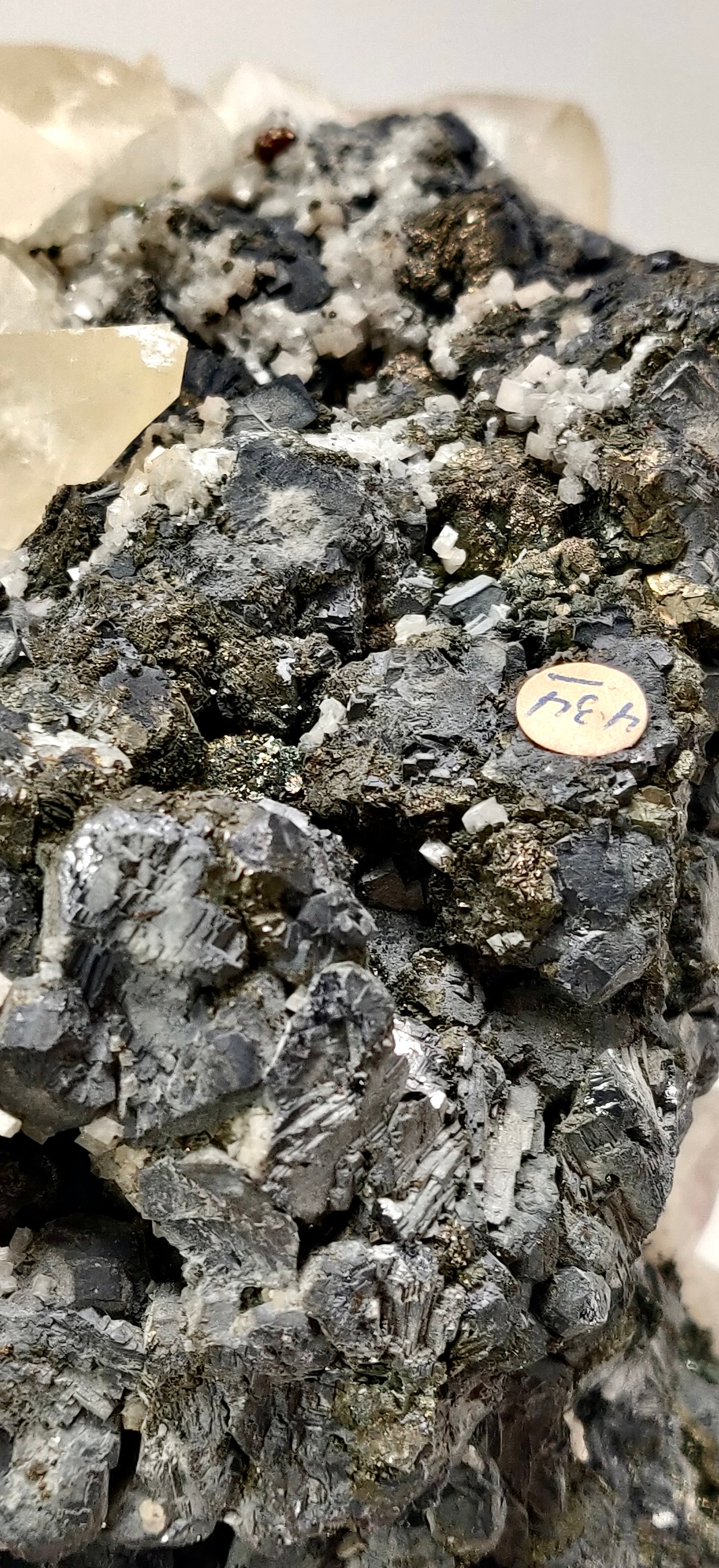 Mineral sample with crystals on a white background