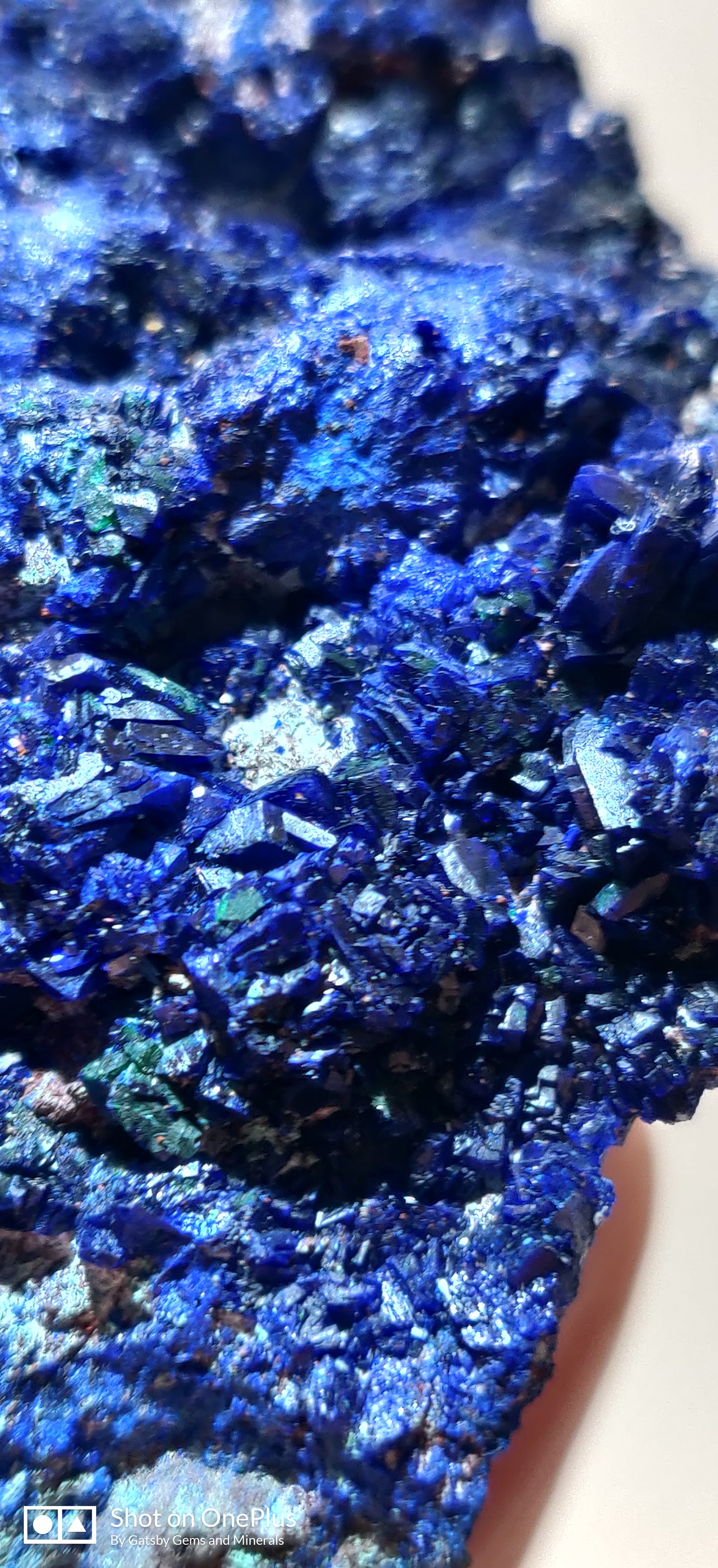 Close-up of blue mineral crystals on a white background