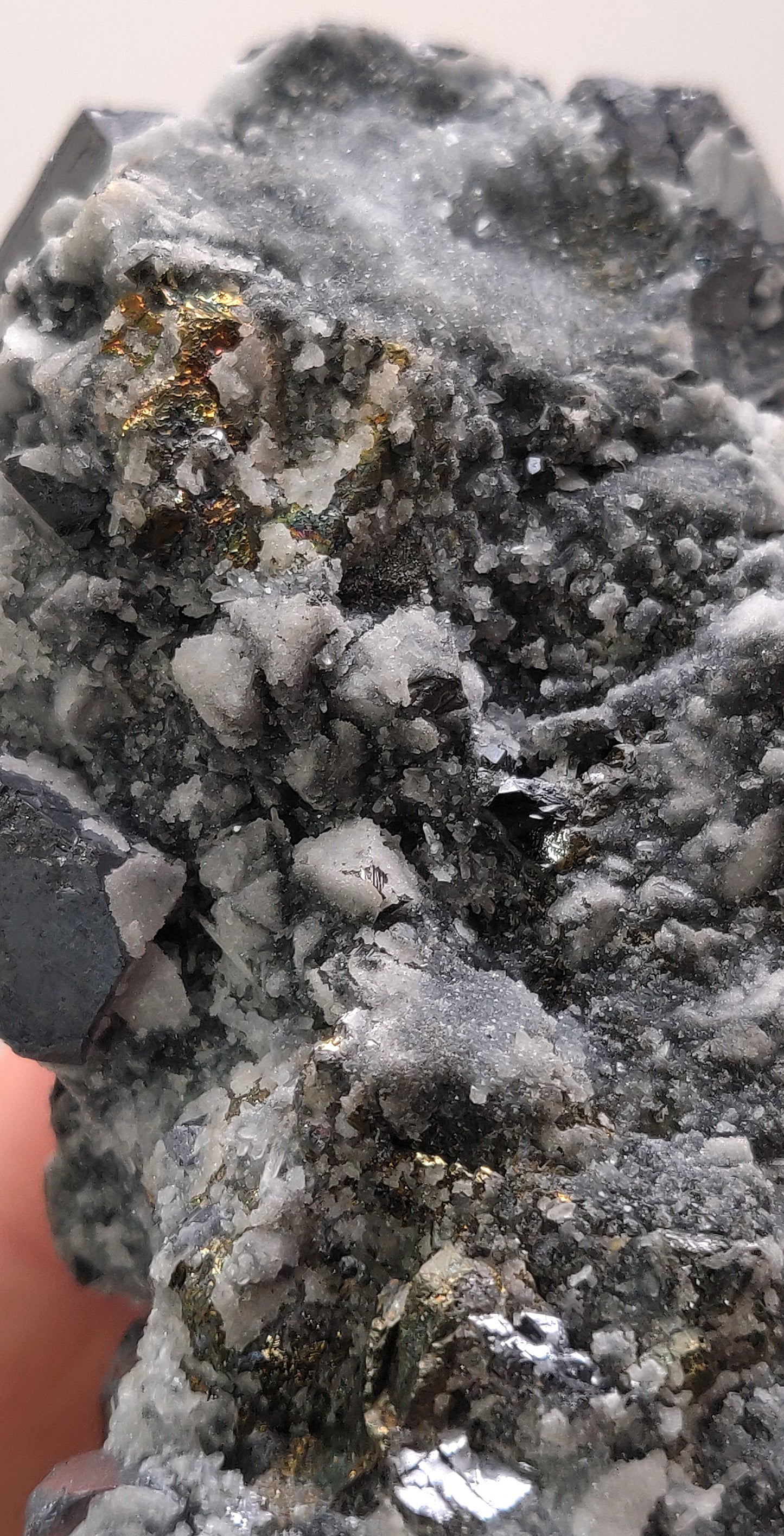 Close-up of metallic Galena crystal cluster with jet-black octahedral Sphalerite and golden Chalcopyrite from the Madan Ore Field, Bulgaria.