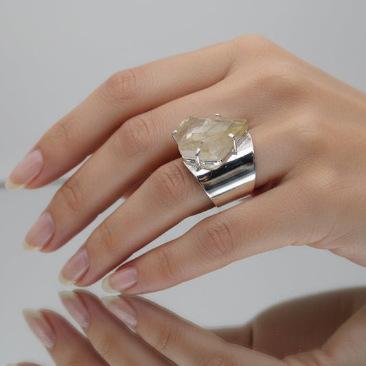 Crystal on a stand against a gray background