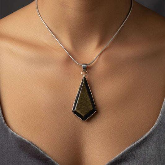 Geometric pendant necklace on a white background